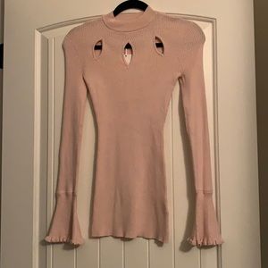 Light pink turtleneck with flared sleeves